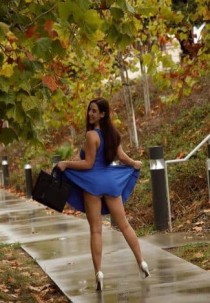 Escort NATASHA with brunette hair