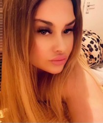 Escort Zina with blonde hair