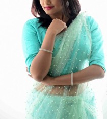 Escort KUSUM TANDON with brunette hair