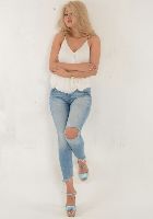 Zhanna`s blonde hair and lovely face oozes femininity