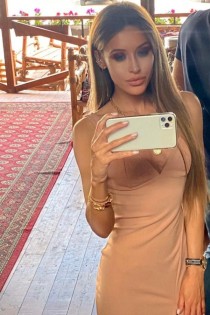 Escort Arina with blonde hair